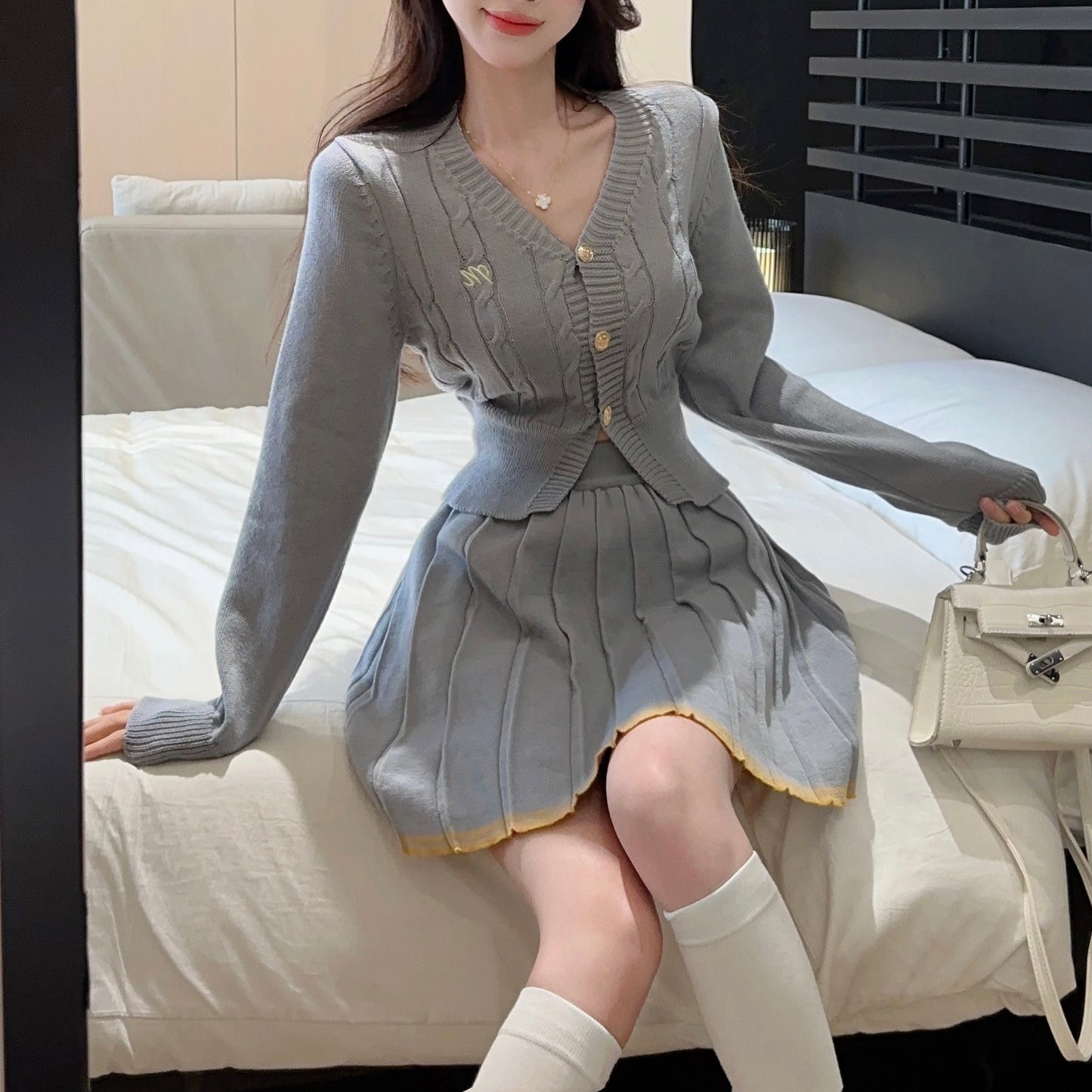 Fashionable And Sexy V-Neck Single-Breasted Knitted Cardigan Top And Skirt Two-Piece Set