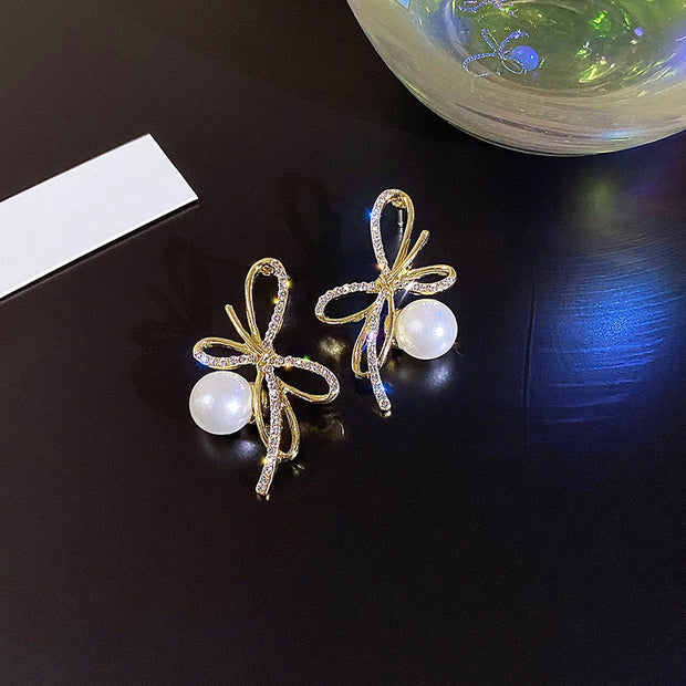 Silver post bow glitter diamond pearl earrings