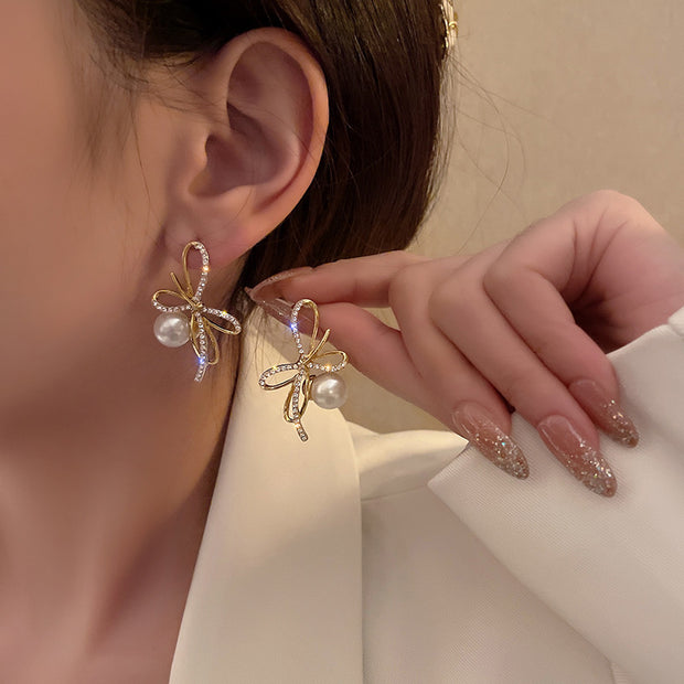 Silver post bow glitter diamond pearl earrings