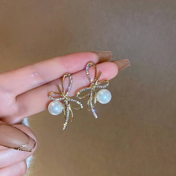 Silver post bow glitter diamond pearl earrings